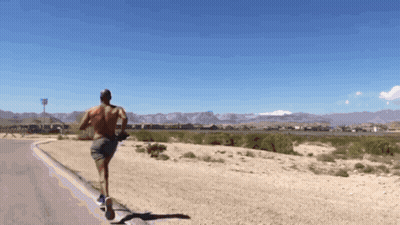 Shirtless Man Running In Desert GIF