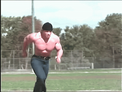Shirtless Man Running On Field With Trees GIF