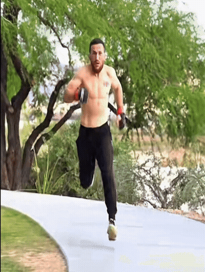 Shirtless Man Running On Path With Trees GIF