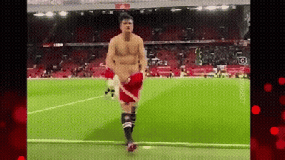 Shirtless Man Running On Soccer Field GIF