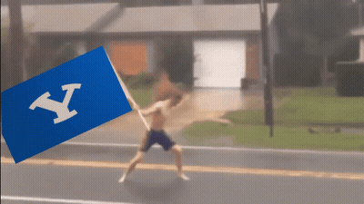 Shirtless Man Running With Blue Flag Letter Y GIF