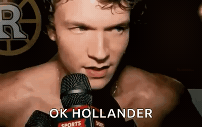 Shirtless Man Saying Ok Hollander Into Mic GIF