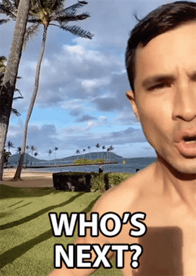 Shirtless Man Saying Who's Next At Beach GIF