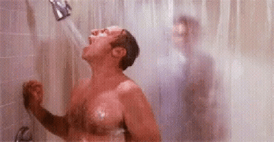 Shirtless Man Showering With Another Man Behind GIF