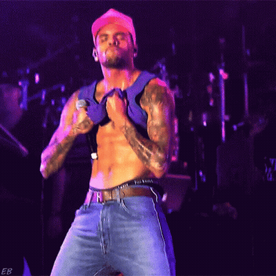Shirtless Man Singing Into Microphone GIF