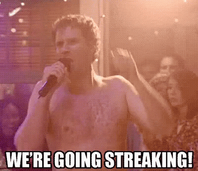 Shirtless Man Singing Into Microphone In Crowd GIF