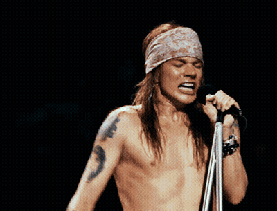 Shirtless Man Singing Into Microphone Mouth Open GIF