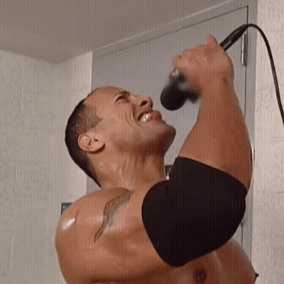 Shirtless Man Singing Into Microphone GIF