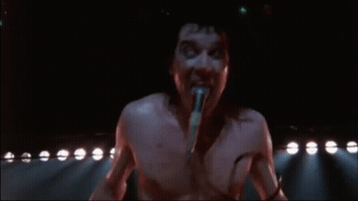 Shirtless Man Singing Into Microphone GIF