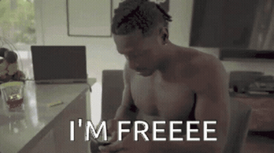 Shirtless Man Sits Laptop Says I'm Freeee On Phone GIF