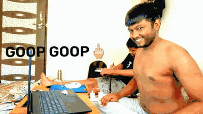 Shirtless Man Sitting At Laptop With Goop Goop On Wall GIF
