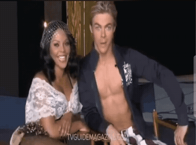 Shirtless Man Sitting Next To Woman With TVGuideMagazine.com GIF