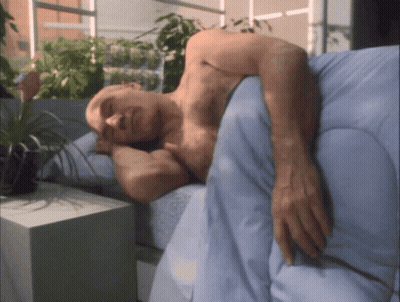 Shirtless Man Sleeping On Bed With Blue Blanket GIF