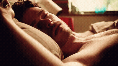 Shirtless Man Sleeping With Arms Outstretched GIF