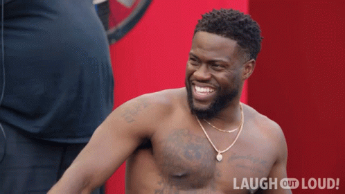 Shirtless Man Smiling In Front Of Red Background Saying Laugh Out Loud GIF