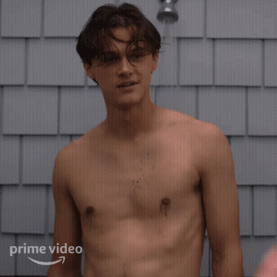 Shirtless Man Smiling In Shower With Prime Video Logo GIF