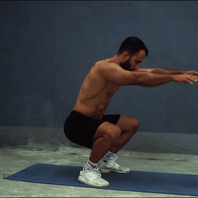 Shirtless Man Squatting On Yoga Mat GIF