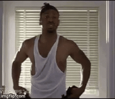 Shirtless Man Standing At Window Hands On Hips GIF