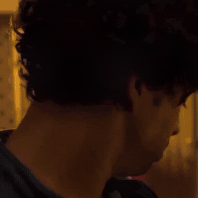 Shirtless Man Standing Before UFC Sign GIF
