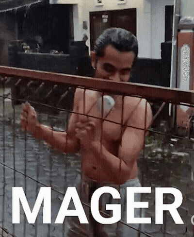 Shirtless Man Standing Behind Flooded Fence With Mager GIF