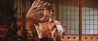 Shirtless Man Standing By Window GIF