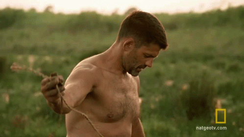 Shirtless Man Standing In Field GIF