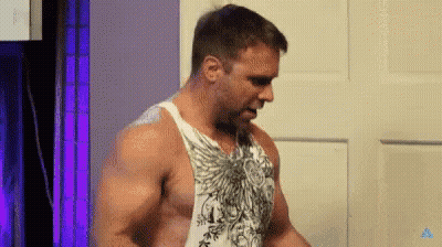 Shirtless Man Standing In Front Of Door GIF
