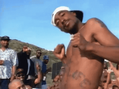 Shirtless Man Standing In Front Of Group GIF