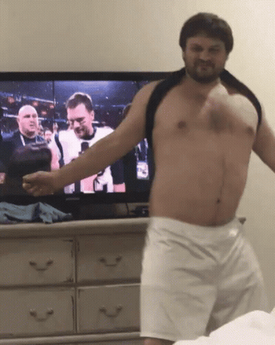 Shirtless Man Standing In Front Of TV GIF