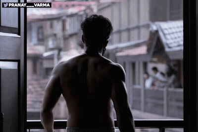 Shirtless Man Standing In Front Of Window Pranay Varma GIF