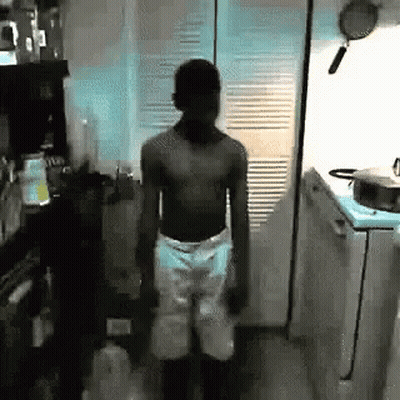Shirtless Man Standing In Kitchen GIF