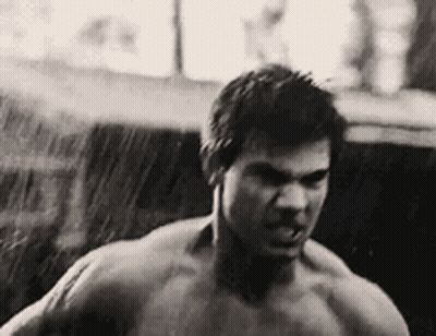 Shirtless Man Standing In Rain GIF