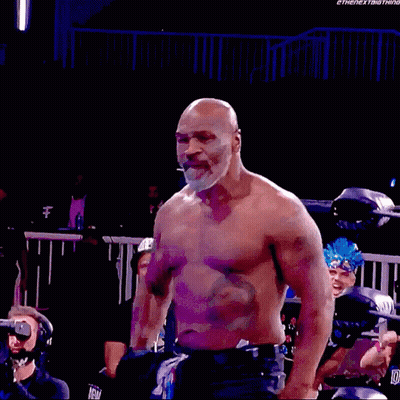 Shirtless Man Standing In Wrestling Ring GIF