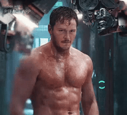 Shirtless Man Standing Next To Machine GIF