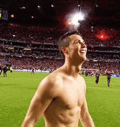 Shirtless Man Standing On Soccer Field GIF