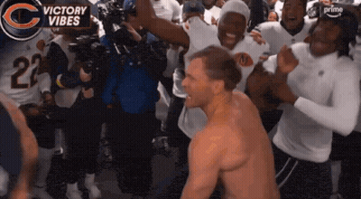 Shirtless Man Surrounded By Players With Number 23 Jerseys GIF