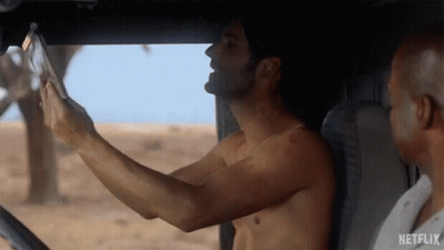 Shirtless Man Taking Selfie In Car GIF