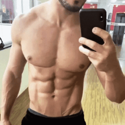 Shirtless Man Taking Selfie In Gym GIF