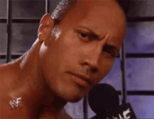 Shirtless Man Talking Into Microphone Making Funny Face GIF
