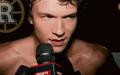 Shirtless Man Talking Into Sports Microphone GIF
