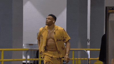 Shirtless Man Walking Through Security Checkpoint GIF