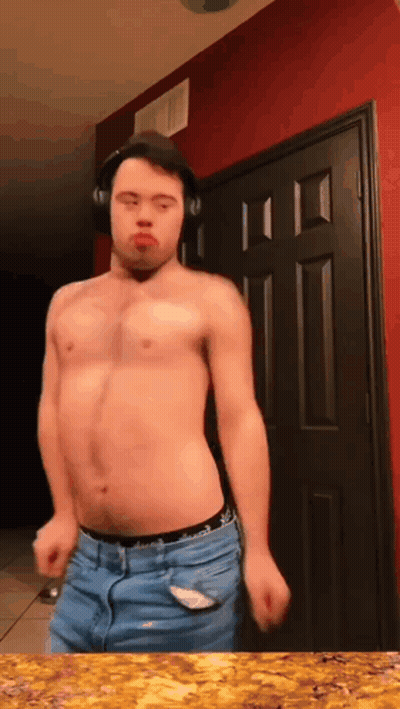 Shirtless Man Wearing Headphones Dancing In Front Of Door GIF