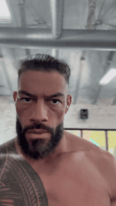 Shirtless Man With Beard And Arm Tattoo GIF