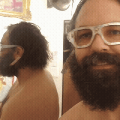 Shirtless Man With Beard and Glasses