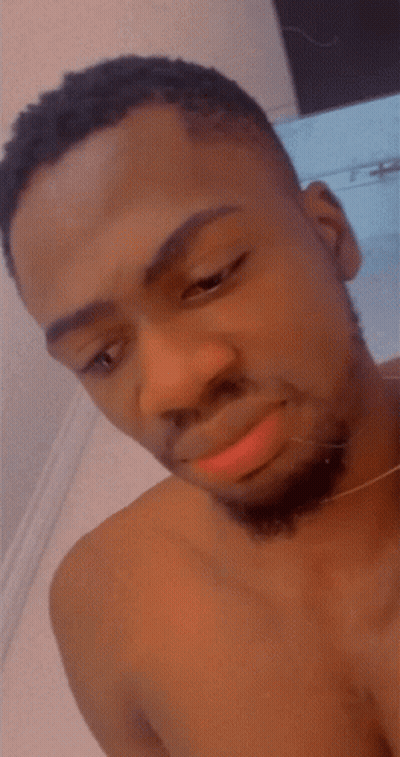 Shirtless Man With Beard Looking Up GIF