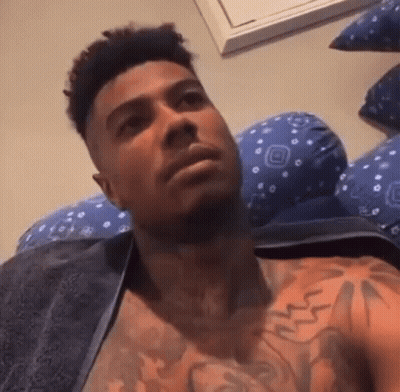 Shirtless Man With Chest Tattoo Laying On Bed GIF