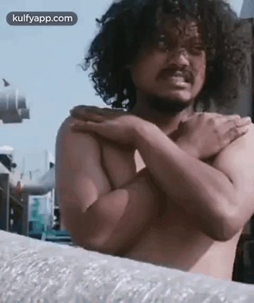 Shirtless Man With Curly Hair Holding Shoulder GIF