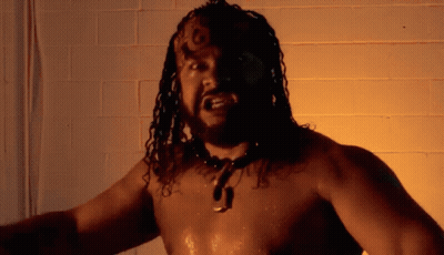 Shirtless Man With Dreadlocks And J Necklace GIF