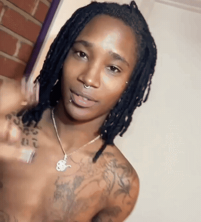 Shirtless Man With Dreadlocks And Nose Ring Pointing At Camera GIF