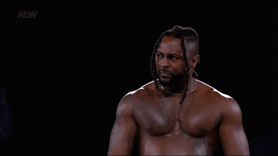 Shirtless Man With Dreadlocks In Dark Room GIF